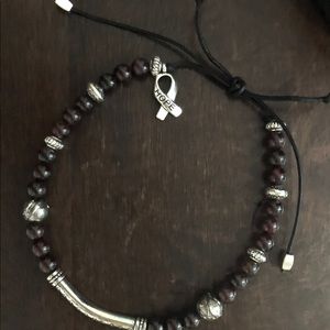 Garnet bracelet, leather adjustable cord